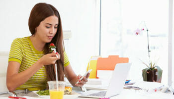 employees eating at desks
