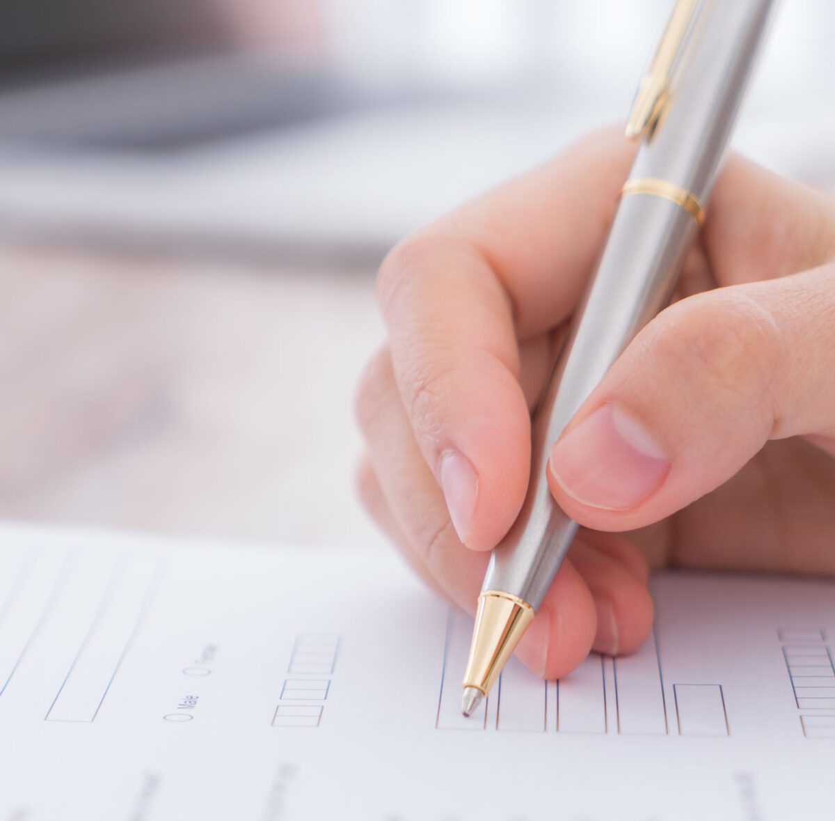 We can help you with VAT registration Image of a hand using a pen to fill in a VAT registration form