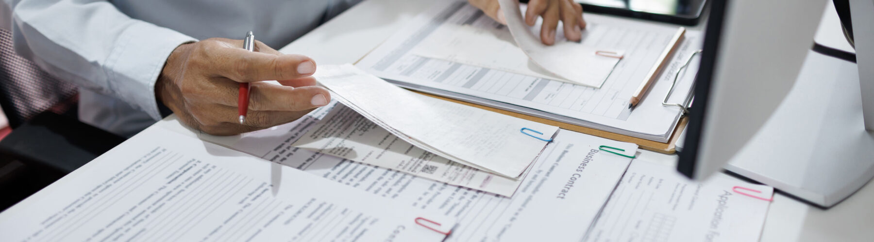 Image of someone working on financial paperwork