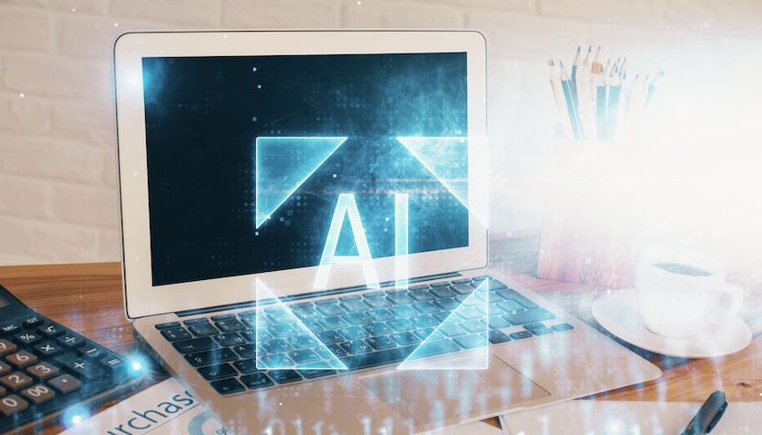 Image of a laptop computer with an overlay that reads AI - to illustrate a blog post on AI in accounting software