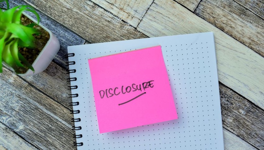 The word 'DISCLOSURE' on a post-it note, illustrating an article on FRS 102 Section 1A disclosure requirements