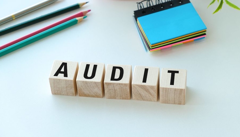 Wooden blocks spelling out the word AUDIT - to accompany an article on 5 ways to prepare for a small business audit