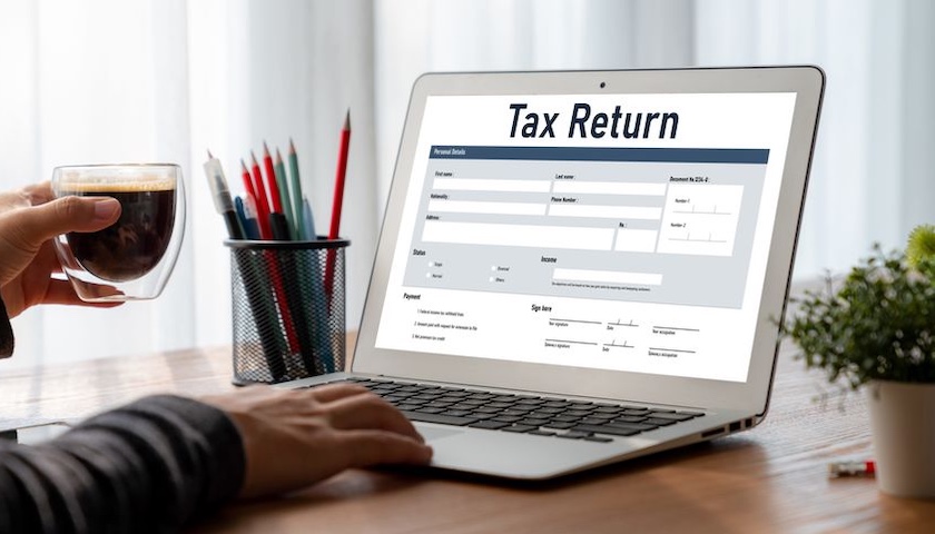 Image of a laptop displaying a tax return - soon some taxpayers will have to make monthly or quarterly Self Assessment payments on account