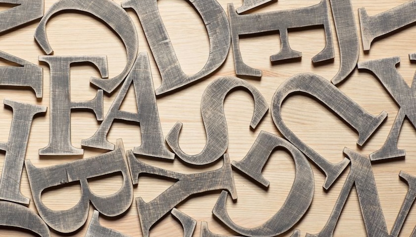 Image of wooden letters to illustrate an article on alphabet shares