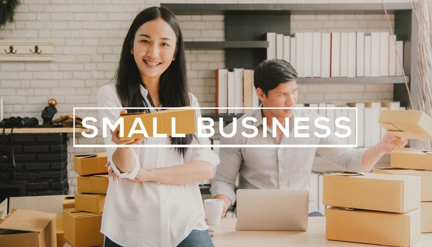 Image of two people with the words SMALL BUSINESS overlaid on them, illustrating an article on small company reporting requirements.